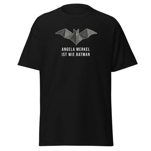 „Schwarzes Herren T‑Shirt mit Origami‑Bat‑Symbol und dem Aufdruck ‚Angela Merkel ist wie Batman‘ aus der Raute – The Comeback Kollektion.“